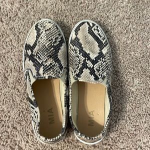 Snake print flats.